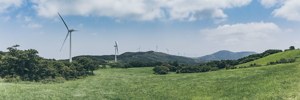 Green field landscape with blue sky
